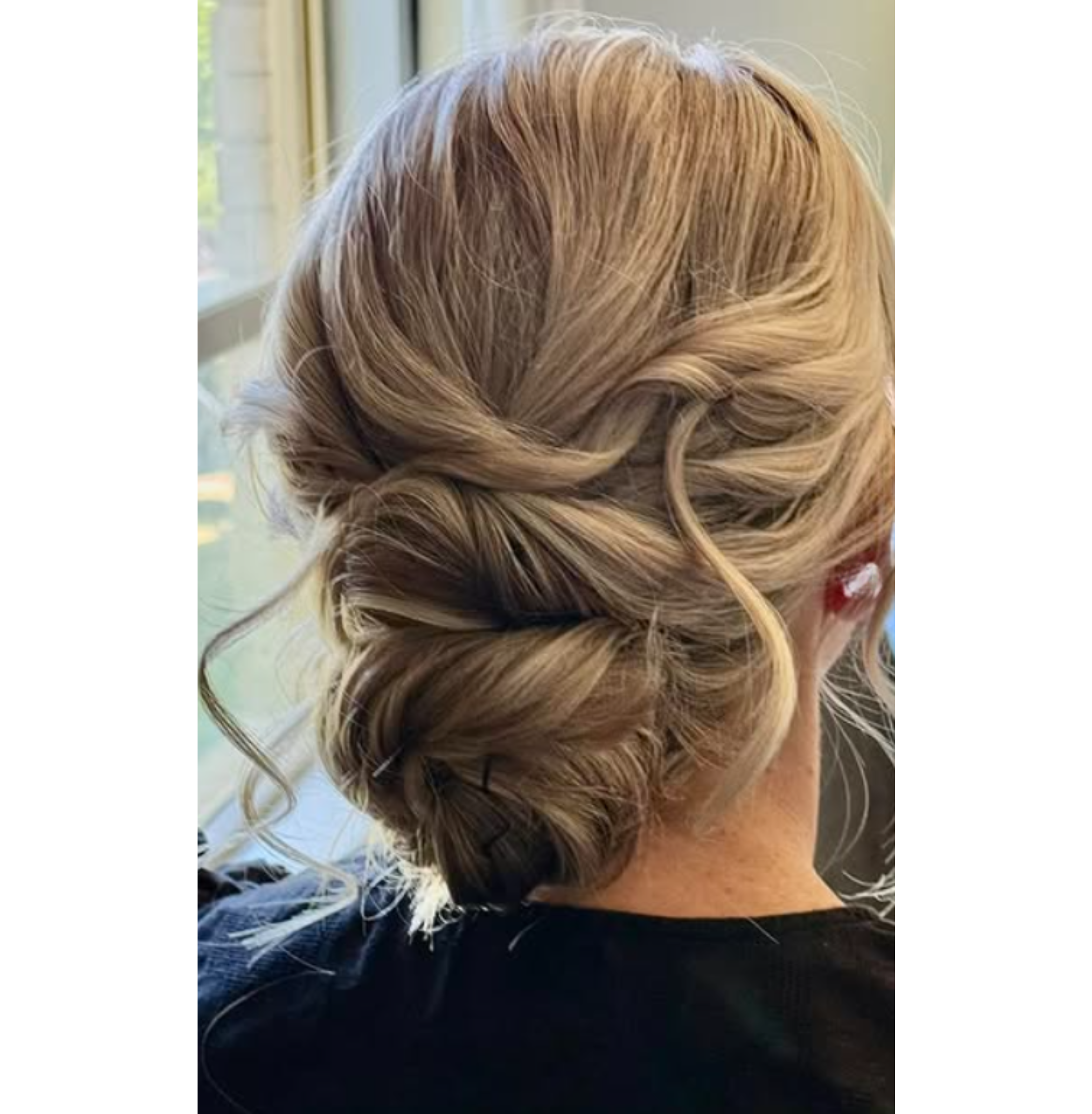 Elegant updo by Blush and Brush by Minee, featuring loose waves and intricate twists for a soft, romantic, and timeless look, perfect for weddings and special events.