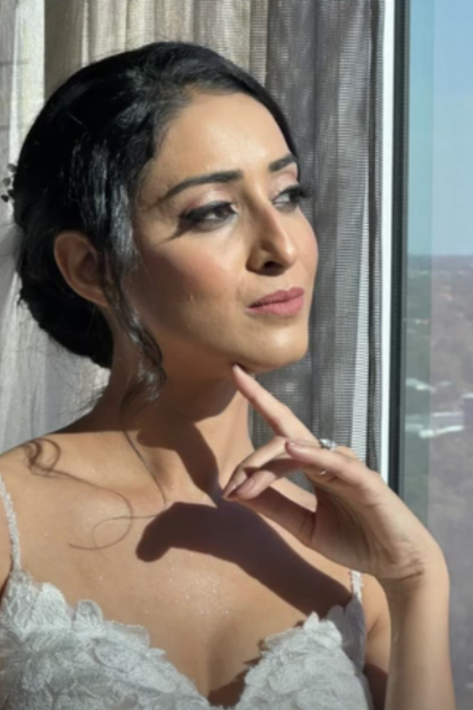 Elegant bun hairstyle and flawless makeup by Blush and Brush by Minee, creating a sophisticated and polished look for weddings, events, or special occasions.