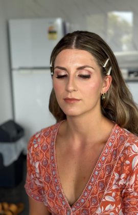 Makeup and hairstyling by Blush and Brush in Perth! A flawless soft glam look with shimmering eyes, rosy lips, and elegant waves, pinned for a perfect finish.